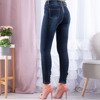 Granatowe jeansy z kokardami - Spodnie