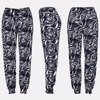 Granatowe spodnie alladynki we wzorki - Odzież
