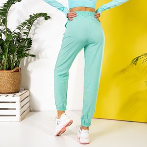 Miętowe spodnie joggery damskie - Odzież