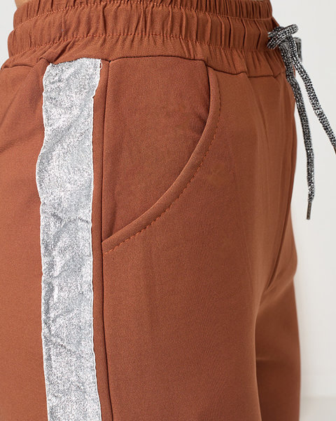 Жіночі утеплені спортивні штани Camel зі сріблястими смужками - Одяг